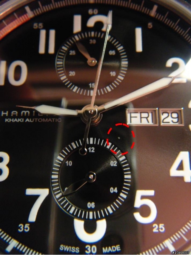 Hamilton Khaki Officer 錶面內有不明顆粒,可以打開取出嗎?