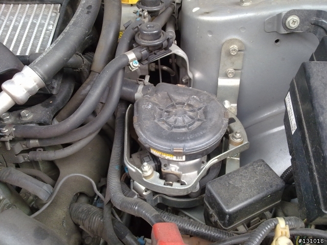 2007 2.5 forester 冷車啟動時引擎室有聲響(請問圖片圓輪外殼裡是甚麼?)